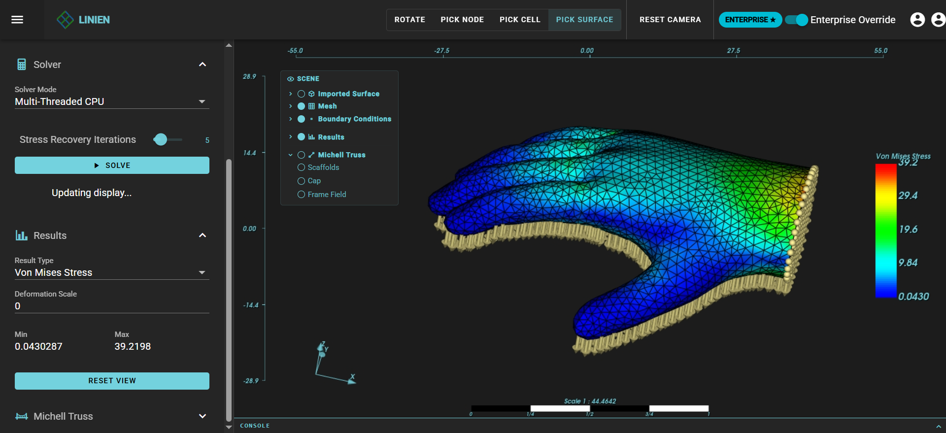 Finite element analysis results showing Von Mises stress distribution with rainbow color gradient from blue to red